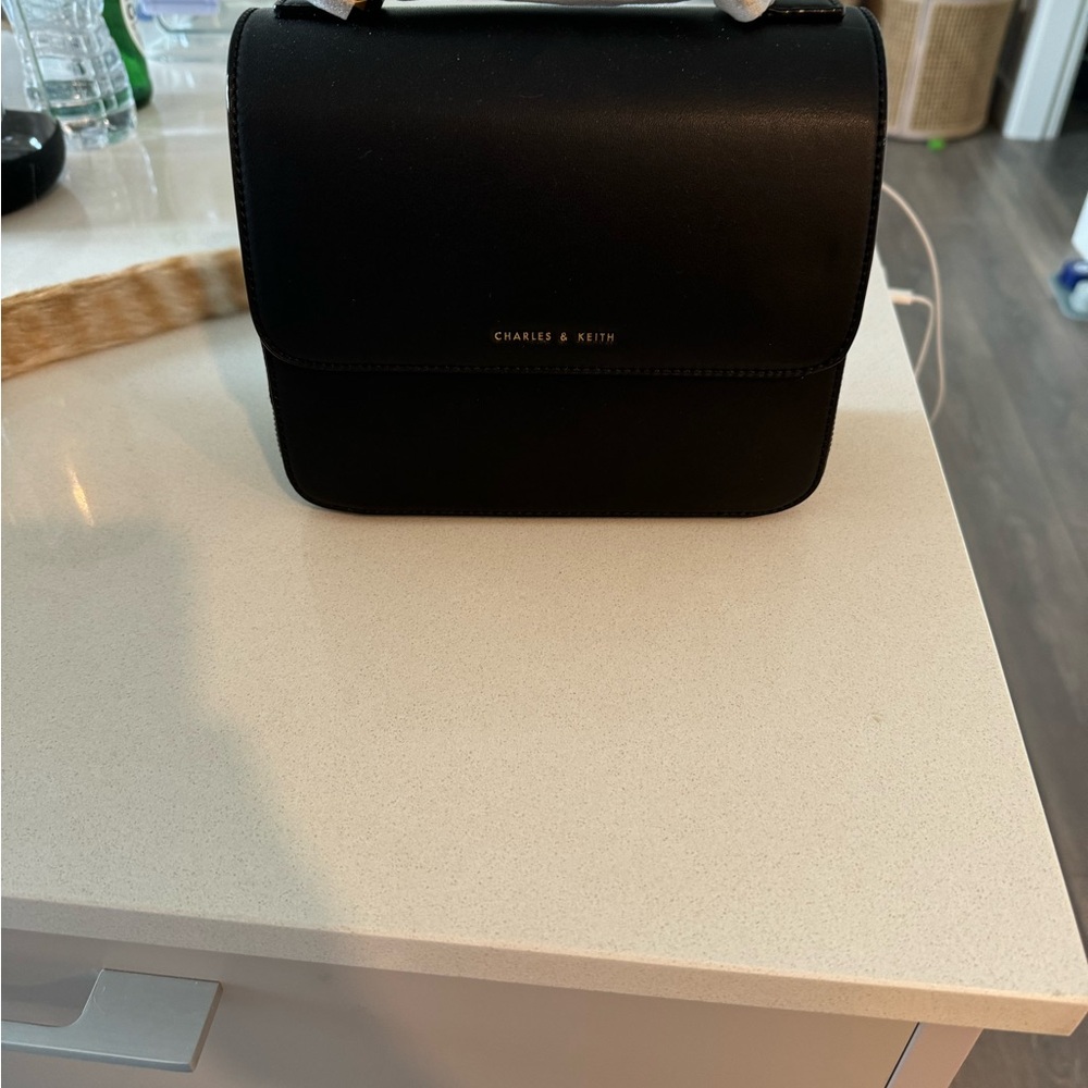 Charles and Keith. Brand new hard black over the shoulder bag  good size bag